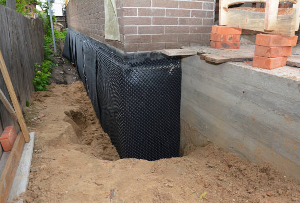 Happy homeowners after waterproofing job in Glenn Dale